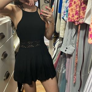 Black romper with skort bottoms and pockets. It can be cheeky if u bend over